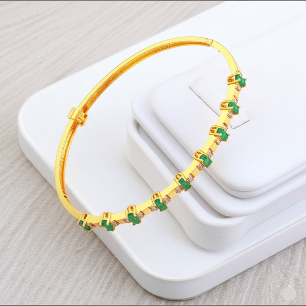 Women's emerald gold and diamond bracelet